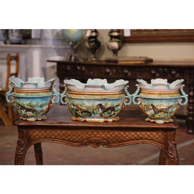 Decorate a buffet or console with this elegant set of majolica cache pots with matching jardiniere. Crafted in France...
