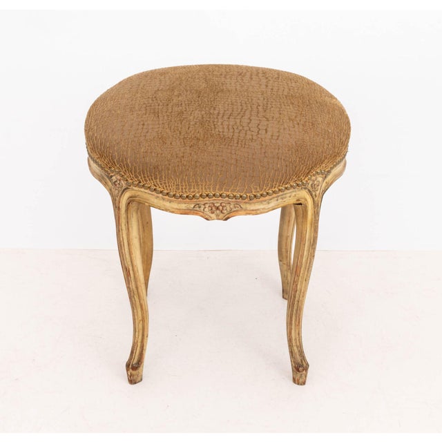 Louis XV Style Snakeskin Print Upholstered Ottoman, with riveted brass nailhead details above a distressed carved wood...