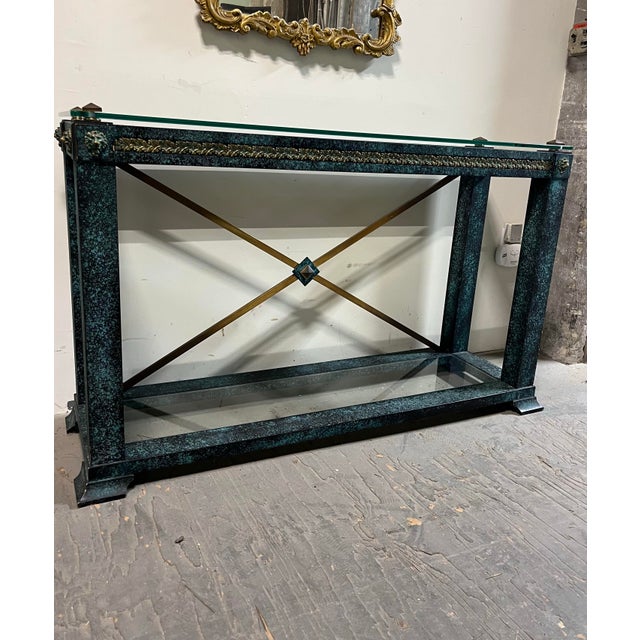 Striking vintage Neoclassical console table featuring a substantial wood frame finished in a richly mottled faux-verdigris...