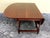 About American Sheraton cherry table with a one board top, two scalloped drop leaves consisting of one board, interior...