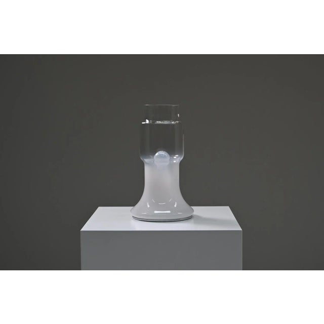 Glass Italian table lamp, 1970s Italy. This elegant table lamp features a beautifully crafted glass shade with a subtle...