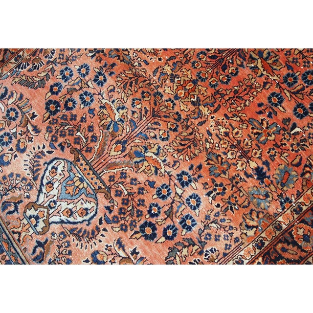 Hand-weaved antique Sarouk rug from the beginning of 20th century. The rug is in original good condition. ​-condition:...