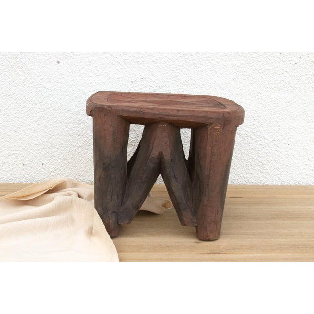 A unique piece of African art, this vintage Nupe table from Nigeria is a must-have for collectors and enthusiasts of Nupe...