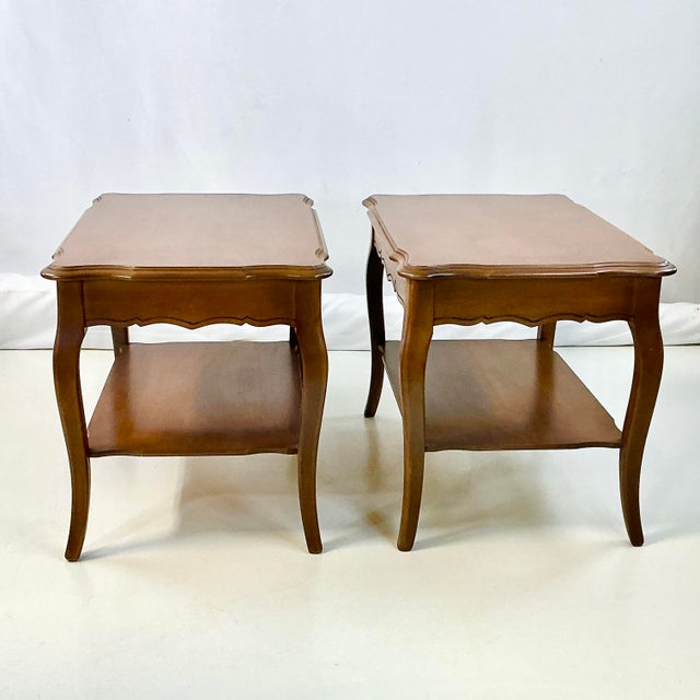 This pair of Bassett Side Tables are traditional French Provincial style. Crafted from maple, they are from the 1950s and...