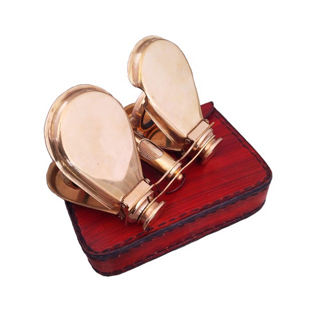 Experience timeless elegance with these antique brass opera binocular glasses, a beautiful reproduction designed to...