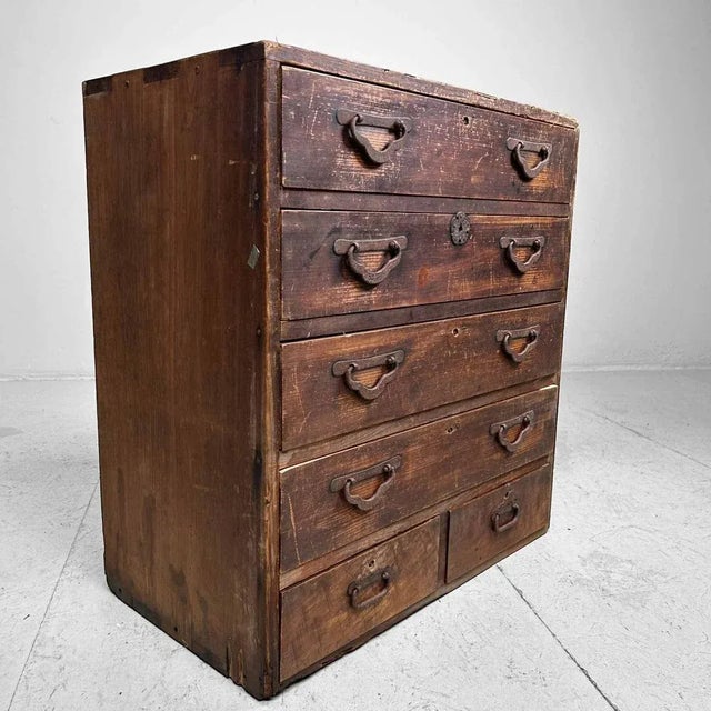 Traditional drawer cabinet with six spacious drawers, crafted from lightweight paulownia wood. The drawers feature metal...