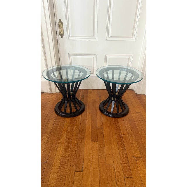 An exceptional pair of round side tables designed by Edward Wormley for Dunbar Furniture, featuring the iconic sheaf of...