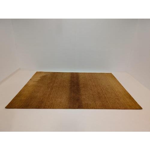 Hand-dyed yarns combine with hard twisted wool create a subtle, striated effect in this group of area rugs. Hand-loomed of...