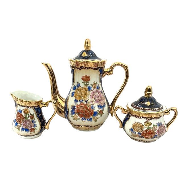 The Vintage Satsuma Blue & Gold Floral Tea Set is a beautiful and rare 15 piece set originating from China with a touch of...