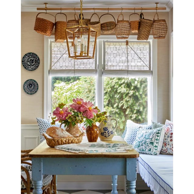 This rare, almost square Kubu rattan basket is a beautifully handwoven piece featuring the signature gray‑washed patina...