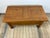 Solid oak coffee table with a top that opens to reveal a storage compartment, one of which is partially divided. A high-...