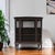 A vintage oak bow-front display cabinet with curved glass on three sides, sculptural claw feet and a compact 49-inch-wide...