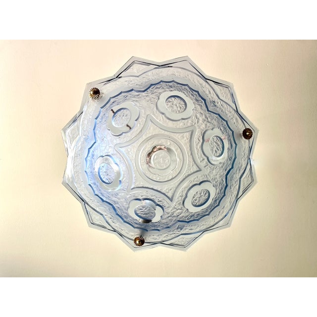 Art Deco pendant light from the 1930s, Degué style, in frosted blue pressed glass decorated with geometric flowers...