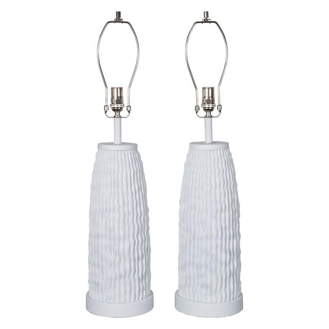 Pair of white organic, ridged composition table lamps.