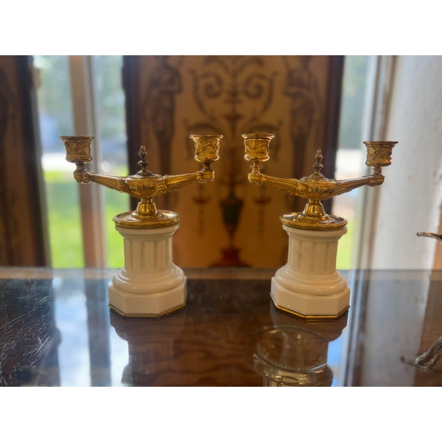Italian or French, early 19th century. A fantastic pair of 19th century Grand Tour gilt bronze candelabras in the...