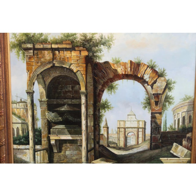 Oil landscape on canvas displayer on giltwood frame This is a stunning almost surrealist painting of an antient arch ruin...