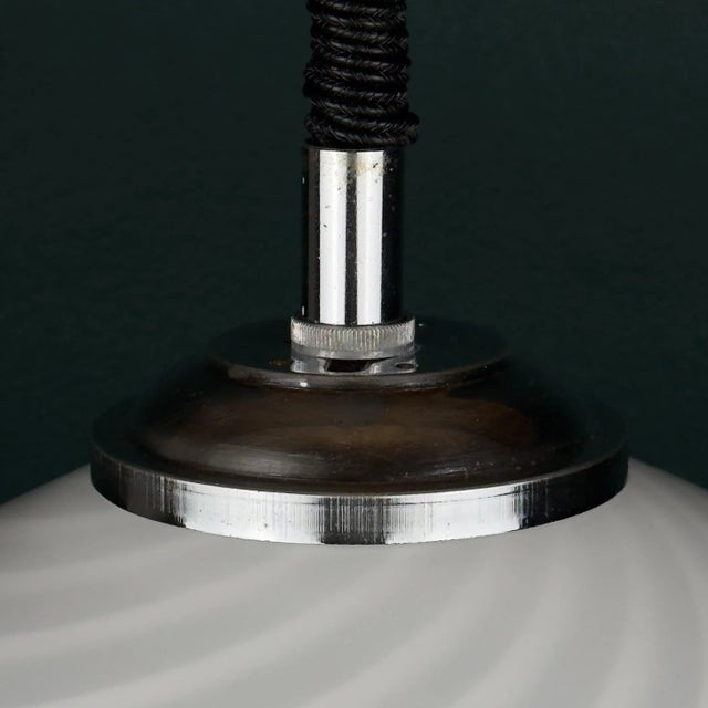 Vintage white murano pendant lamp made in italy in the 1970s. the original manufacturer's label has been partially...