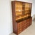 Stunning and highly functional apothecary cabinet from post-war Germany (circa 1950-1960), crafted in warm mahogany veneer...