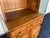 A two-piece hutch cabinet made by Ethan Allen in the late 20th century. Constructed with maple and birch hardwoods, this...