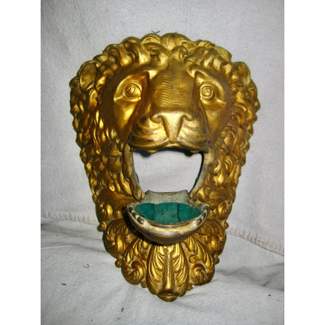 This stunning and large Lion head in brass was at once an ornement of a pool table on one of the four corners ,.The ball...