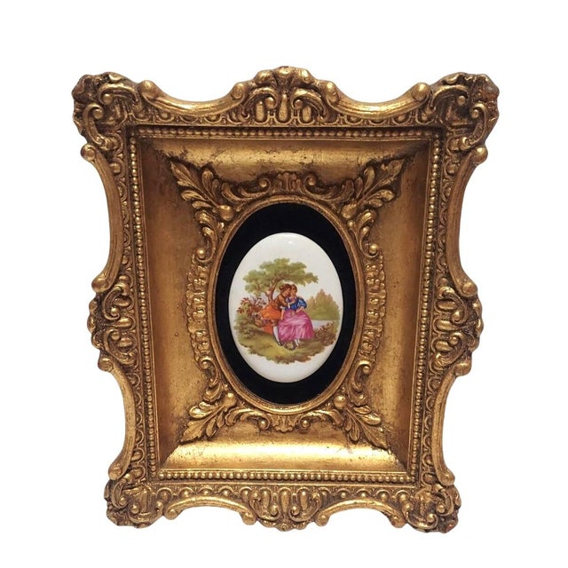 Beautiful courting couple scene. Signed Fragonard on the porcelain oval. Florentine style. Ornate gilt frame made of...