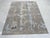 Clara Stylish Gray Hand Knotted Wool Rug, Country of Origin: India. This contemporary piece showcases a dynamic abstract...