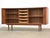 A mid century modern teak credenza with two sliding tambour doors made in Denmark by Dyrlund Furniture. Professionally...