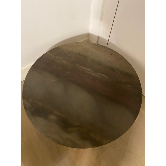 It consists of a round top in marble with a central base in coldtapered metal. The two heights allow an easy combination...