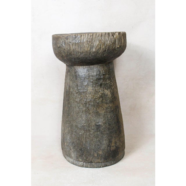 African grain stompers are made when they hollow out tree trucks and large branches to create these which are then used to...