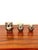 A truly charming trio of sculptural owl-shaped boxes in silver-plated metal, whose decorative presence far surpasses their...