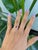 A 1.1-carat pink sapphire glows in a soft, romantic pink at the center of this solid 14K yellow gold ring, cut as an...