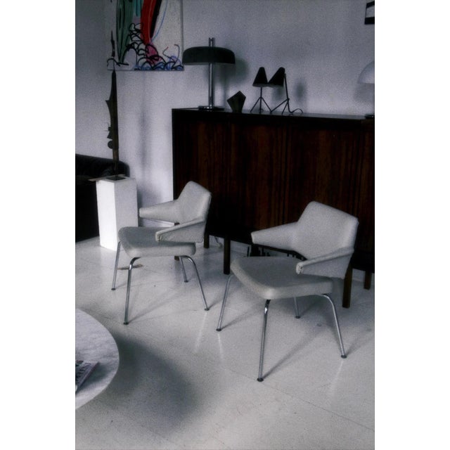 Pair of conference chairs by Jacob Jensen for Duba, Denmark, 1970s. Chrome base, original grey vinyl upholstery. Vintage...