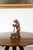 A Black Forest carved wooden sculpture from the late 19th century, depicting a bear standing on a circular base. Created...