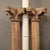Pair of antique, five piece, ribbed teak columns with a round stone base, capital and criss-crossed corbel supports. Posts...