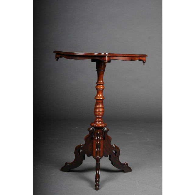 Louis Philippe side table mahogany, around 1860s. Solid wood and mahogany veneer. Multi-pass curved cover plate on...