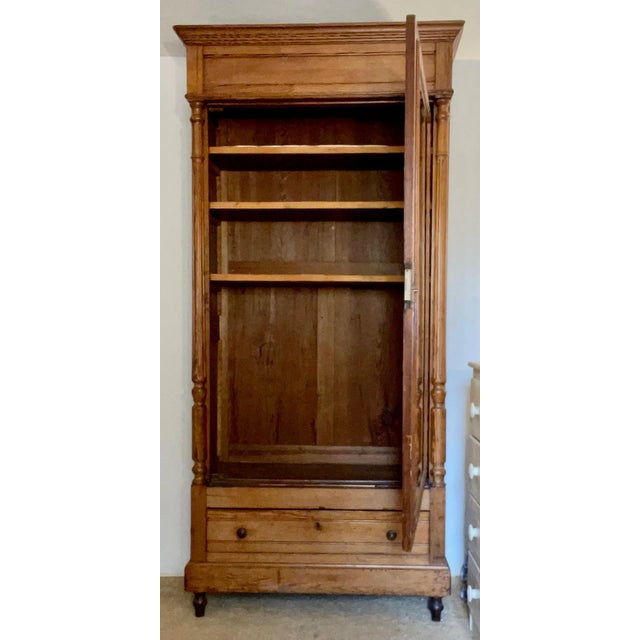 Beautiful simple handmade-design country French armoire with dovetail construction. The pine grain is used artistically...