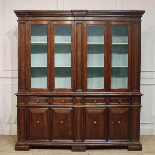19th century Italian walnut glazed dresser / bookcase. 1890. This piece is designed in the style of the selected designer...