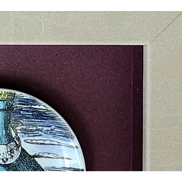 Piero Fornasetti “12 Mesi, 12 Soli” Porcelain Coaster, November, Sun in a Wine Bottle, Framed Milan, circa 1960–1965 This...