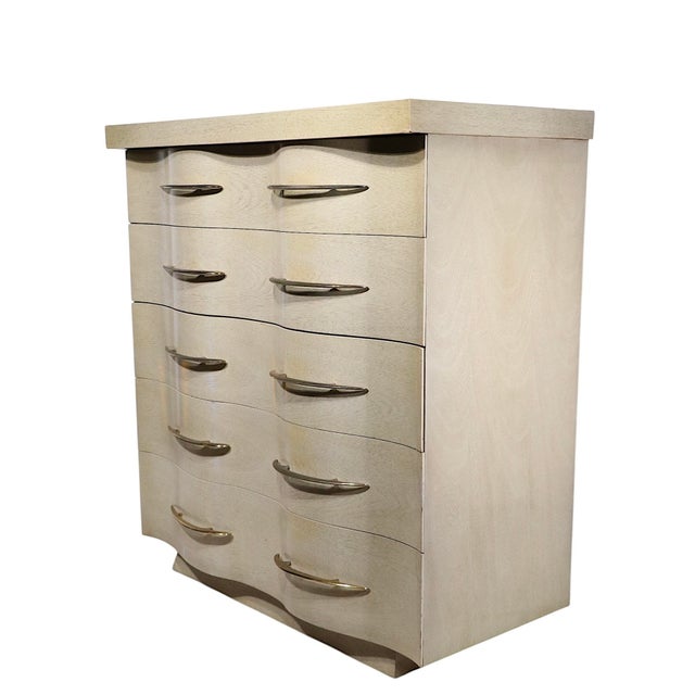 Chic serpentine front five drawer dresser, executed in the Hollywood Regency, Mid Century Modern style, made by Kent...