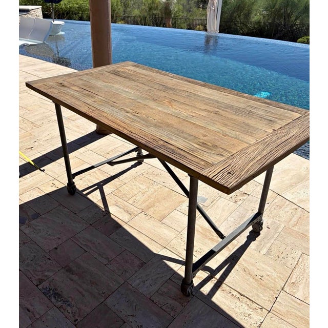 Beautiful character-filled, solid salvaged wood and iron table from a rare retired collection. This 60 inch version is...