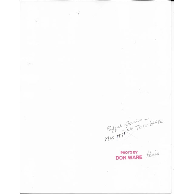 1971 black and white photo by Don Coleman Ware (1921-2006) of a view over the Paris rooftops of the Eiffel Tower. Titled,...