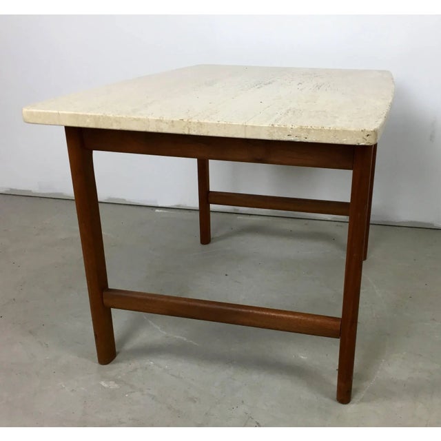 A solid teak lamp table with a travertine marble-top designed by Folke Ohlsson for DUX. In excellent condition and with...