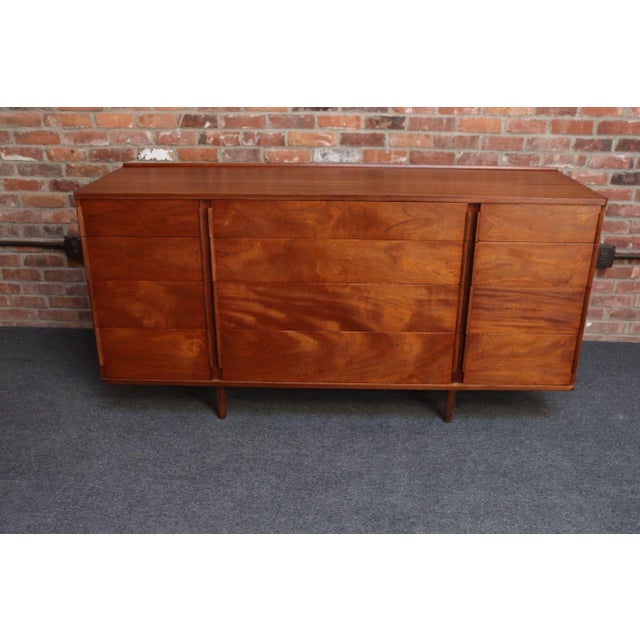 Mid-Century dresser/chest of drawers, model #5272A, designed by Edward Wormley for Dunbar (ca. 1950s, USA). Composed of a...