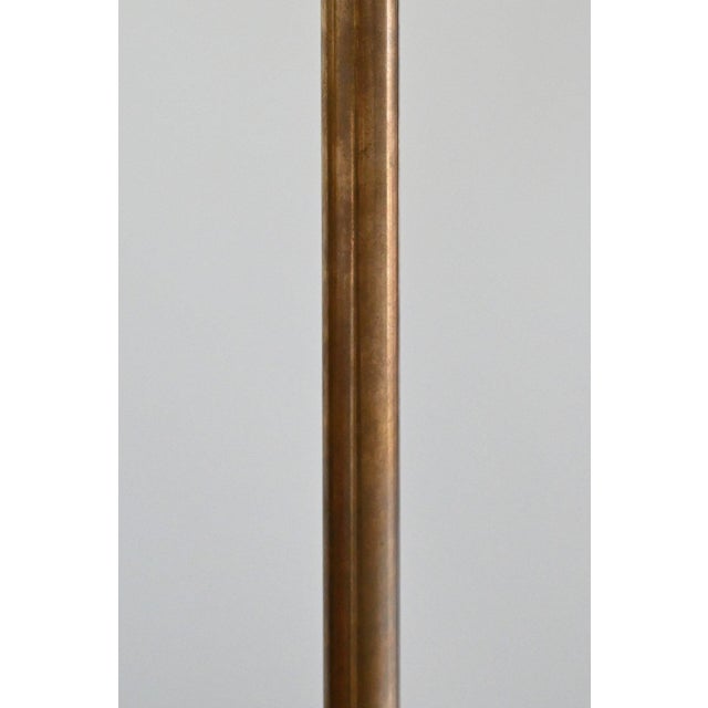 "The Liam" is a sophisticated Walnut pendant that integrates Calacatta Viola marble detailing and an unlacquered brass...