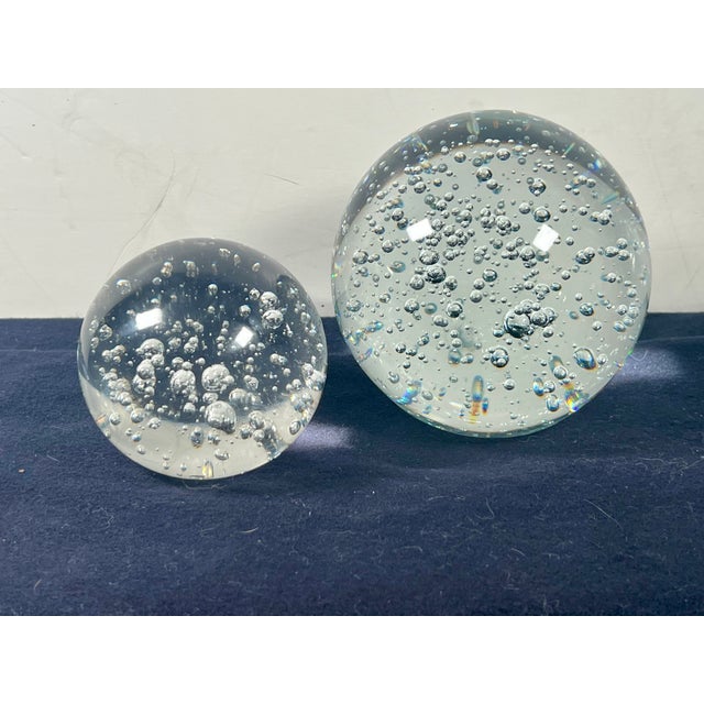 This captivating pair of mid-century modern style art glass paperweights features a classic "Bullicante" controlled bubble...