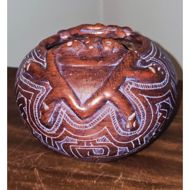 A handcrafted ceramic pot by Brazilian artist Reis Pará, created in the traditional Marajoara style of Marajó Island. The...