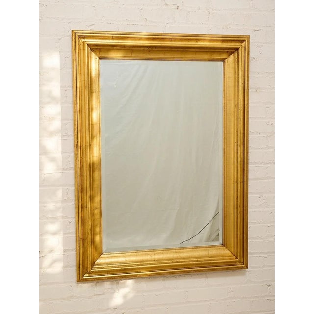 handsome large-scale vintage wall mirror with a warm wood frame and clean rectangular silhouette. Subtle layered molding...