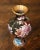 Decorate a table or a buffet with this colorful baluster vase. Created in China circa 1980, the vase features floral and...