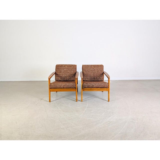 Beautiful set of two vintage armchairs from the 1970s. These so-called "easy chairs" are characterized by their typical...
