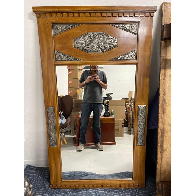 A pretty Art Deco Mirror in the style of Sue Et Mare. This was in the great room of an elegant Palm Springs estate. The...